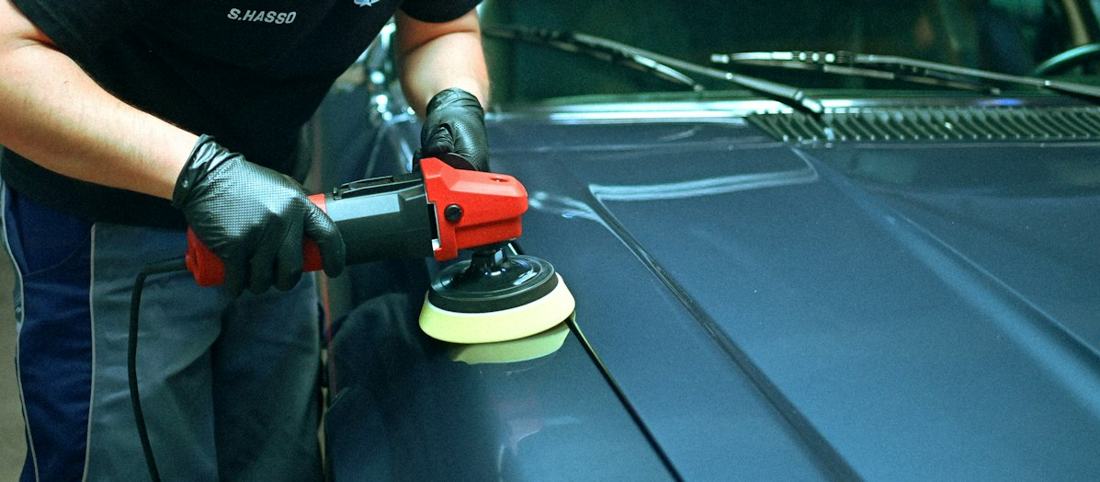 Polishing a car bonnet by hand